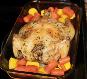 The chicken, partially roasted, is joined by beets and carrots for the remainder of the cook time.