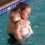 The look on this poor unfortunate mom's face says it all: this trip to the pool did not go as planned. 