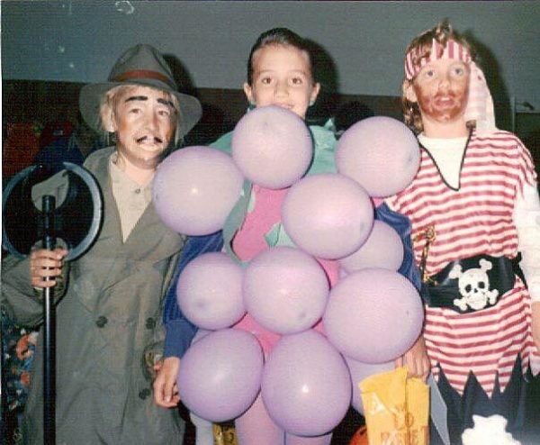 Any kid who can wear balloon grapes has my respect. Also, take note of the axe murderer on the side. Oh, for the more innocent days of the 90s.