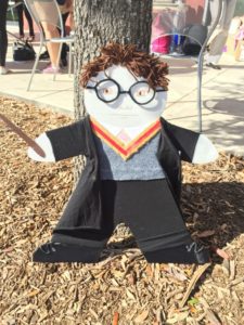 a white cardboard cutout resembling a child dressed as Harry Potter