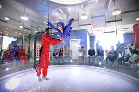 a woman doing indoor skydiving