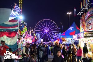family fun at the San Antonio Stock Show and Rodeo night image of carnival games and rides