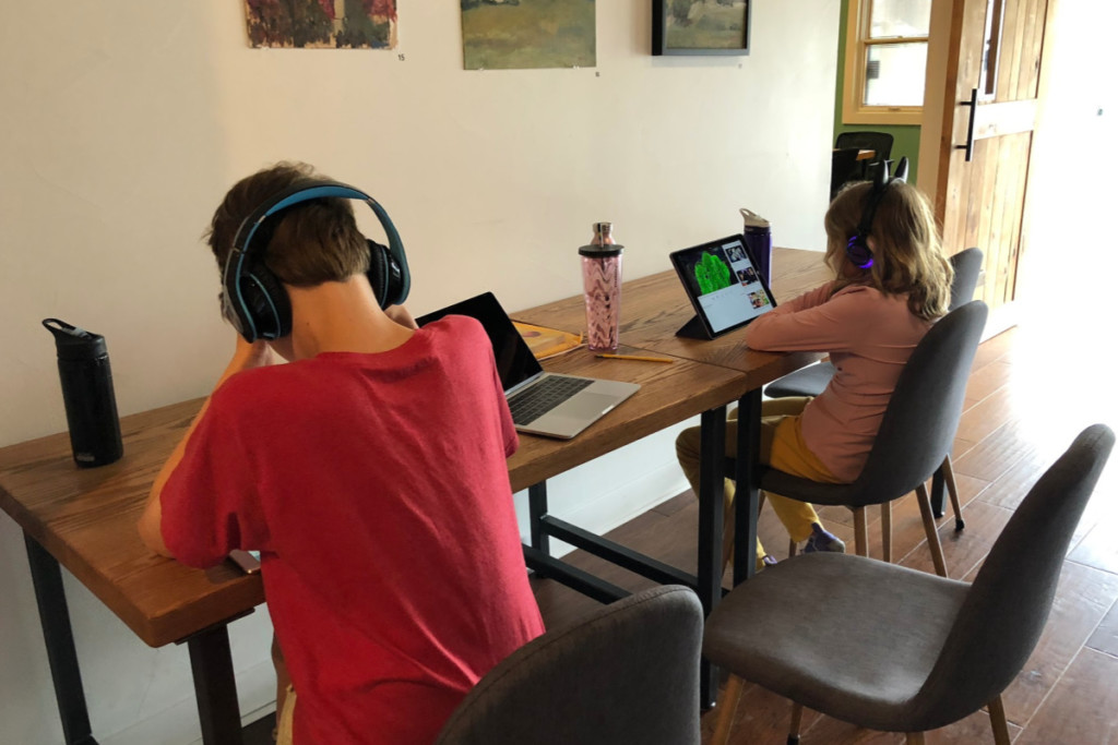 Kids using their tablets while mom works at the Impact Guild | Alamo City Moms Blog