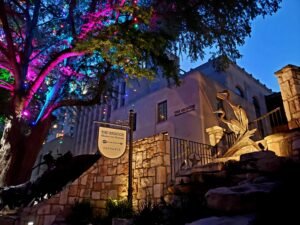 a museum building lit with colored lights