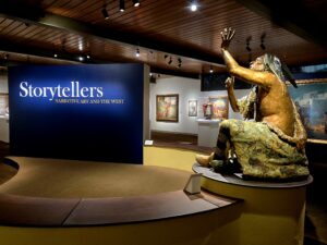 museum exhibition wall with a life-sized Navajo statue 