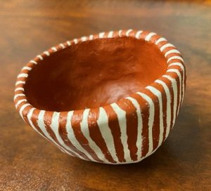 a handmade pottery bowl made by a child