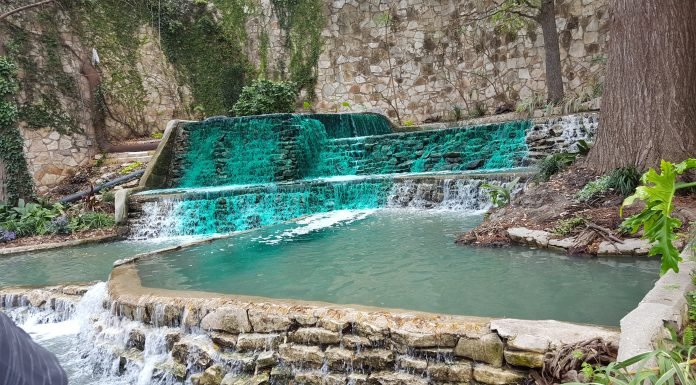 river with green dye flowing through a fountain for St. Patricks Day