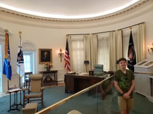 a replica of the oval office with a desk and chairs