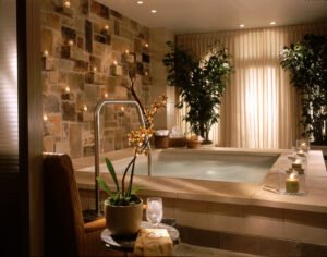 a hottub whirlpool with candles on the wall at a spa