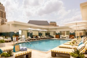 rooftop hotel pool with lounge chairs