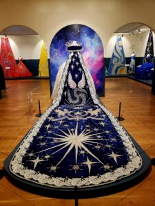 an intricate train for a formal gown featuring a celestial scene